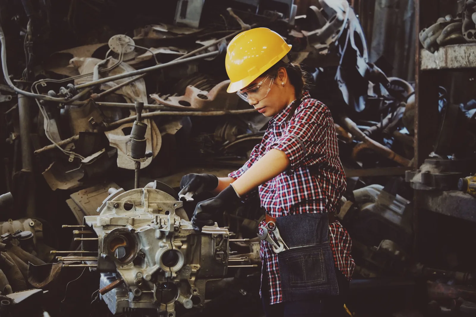 Asian woman engineer working on complex mechanical systems