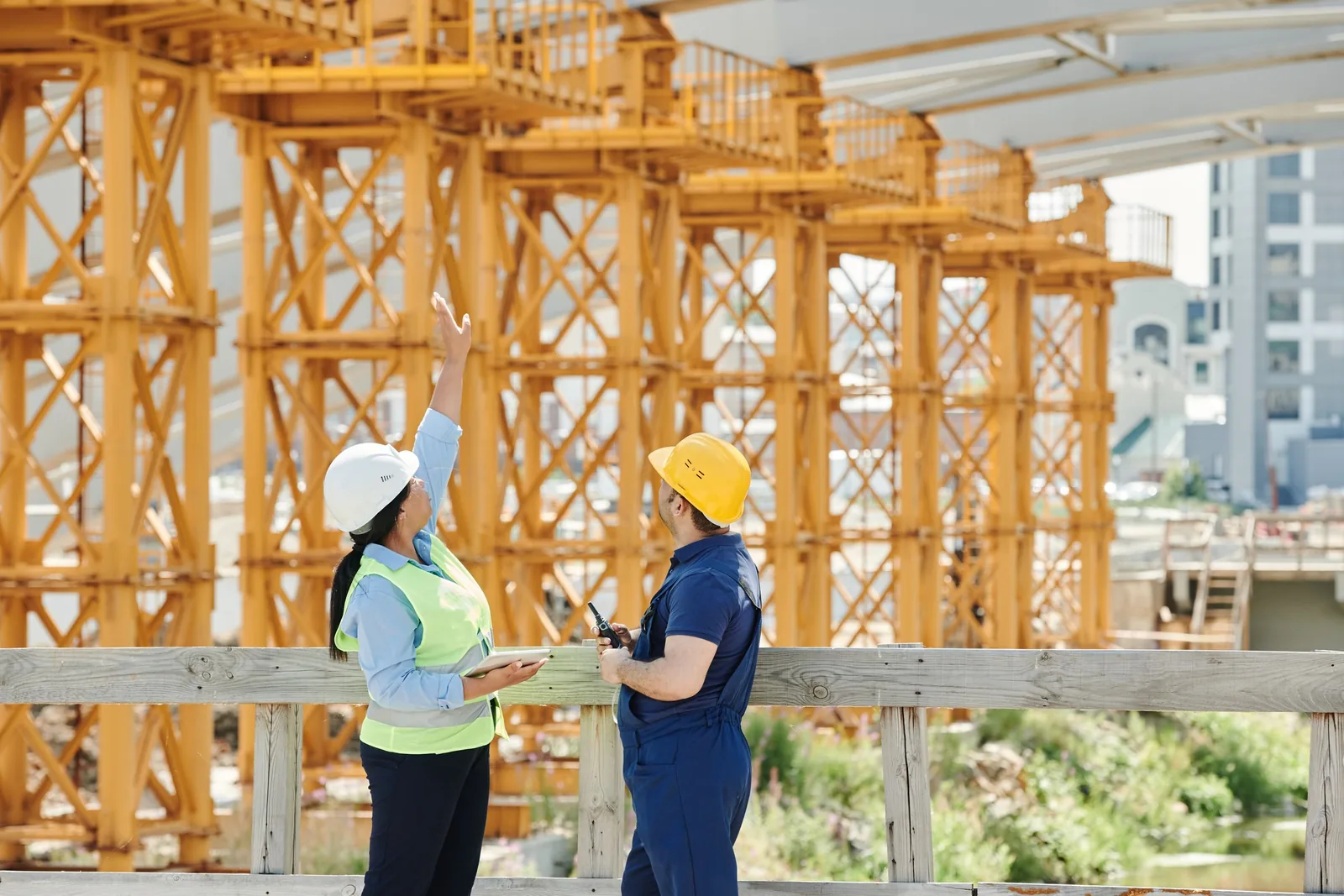 Woman engineer of colour directing a major energy infrastructure project on site